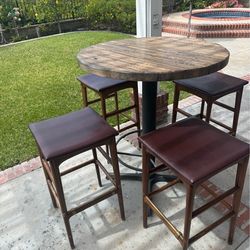 Backyard tall bar table with 4 stool chairs