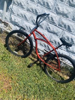 Black and red huffy beach cruiser bike