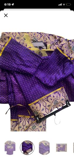 Purple and yellow African print blouse with a touch of boho style #africanprint #boho #festival traditional outfit with intricate designs and embellis