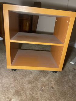 Side table with roller