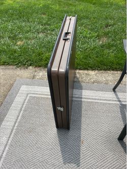 6ft heavy duty banquet table, legs fold up then table folds in half with lock and carry handle.