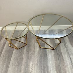 2 glass tables gold 