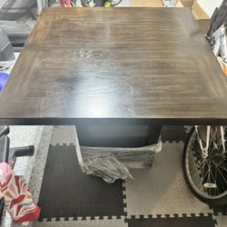 Lightly used Solid dark wood high kitchen table
