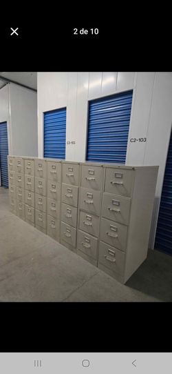 Light gray metal file cabinet with key letter size