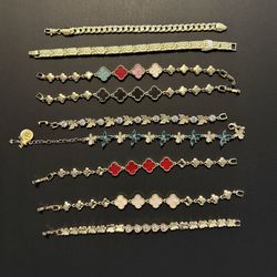 Gold tone bracelets, clover and rhinestone styles