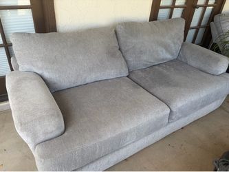Gray couch with ottoman