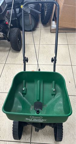 Scott lawn spreading tool machine