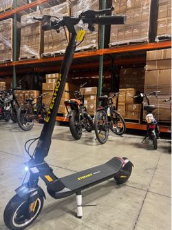 Front and rear shock-absorbing fast electric scooter