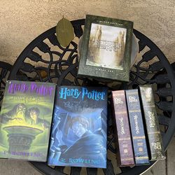 Two Harry Potter hardcover books and Lord of the rings DVD ollection