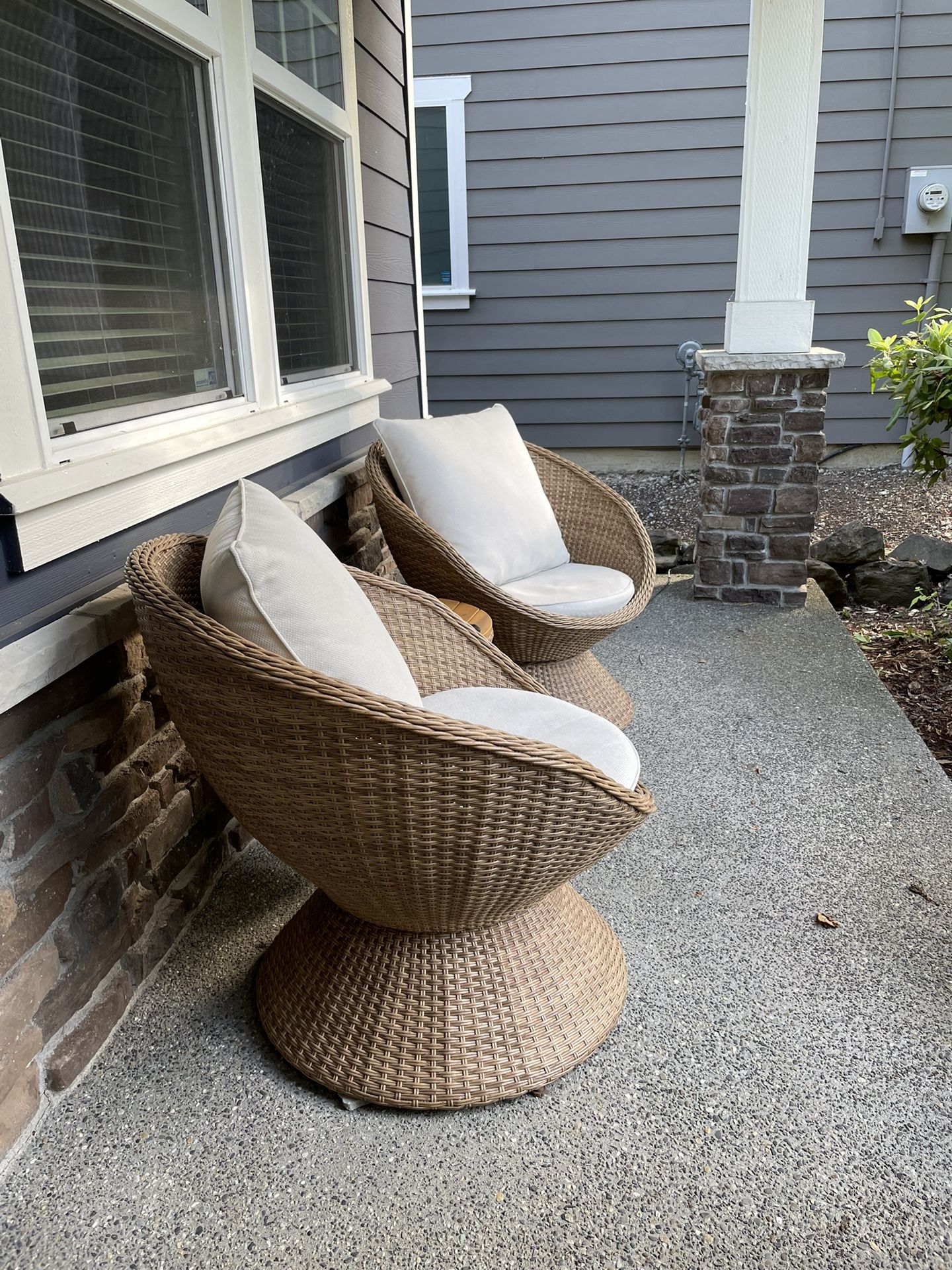Wicker Outdoor Set With Two Swivel Chairs and a Table