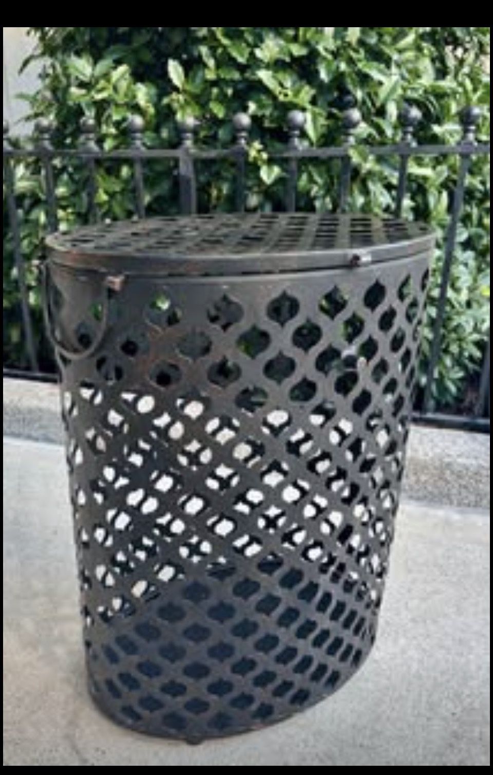metal laundry open mesh hamper with hinged lid.