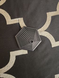 Black hexagonal fidget toy.