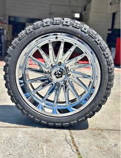 TIS 547C 24x12 8x6.5/165 - 44 chrome with 35x12r24 TBB mud tires