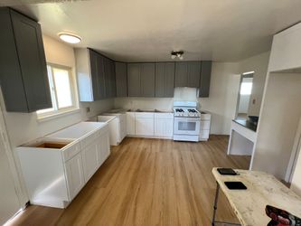 Gray and white kitchen cabinets
