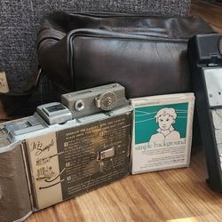 2 OLD Fashion Cameras  1 Pack Of Old Film And Leather Bag 