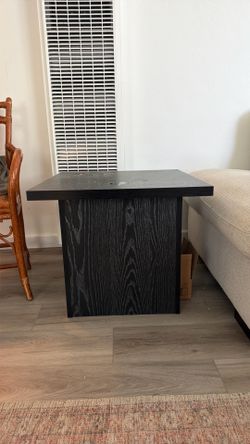 Two black side tables with under storage.