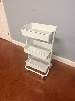 Small white metal storage cart