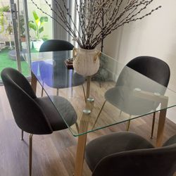 Clean dining table with four chairs