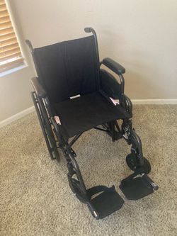 Wheelchair New with Footrests