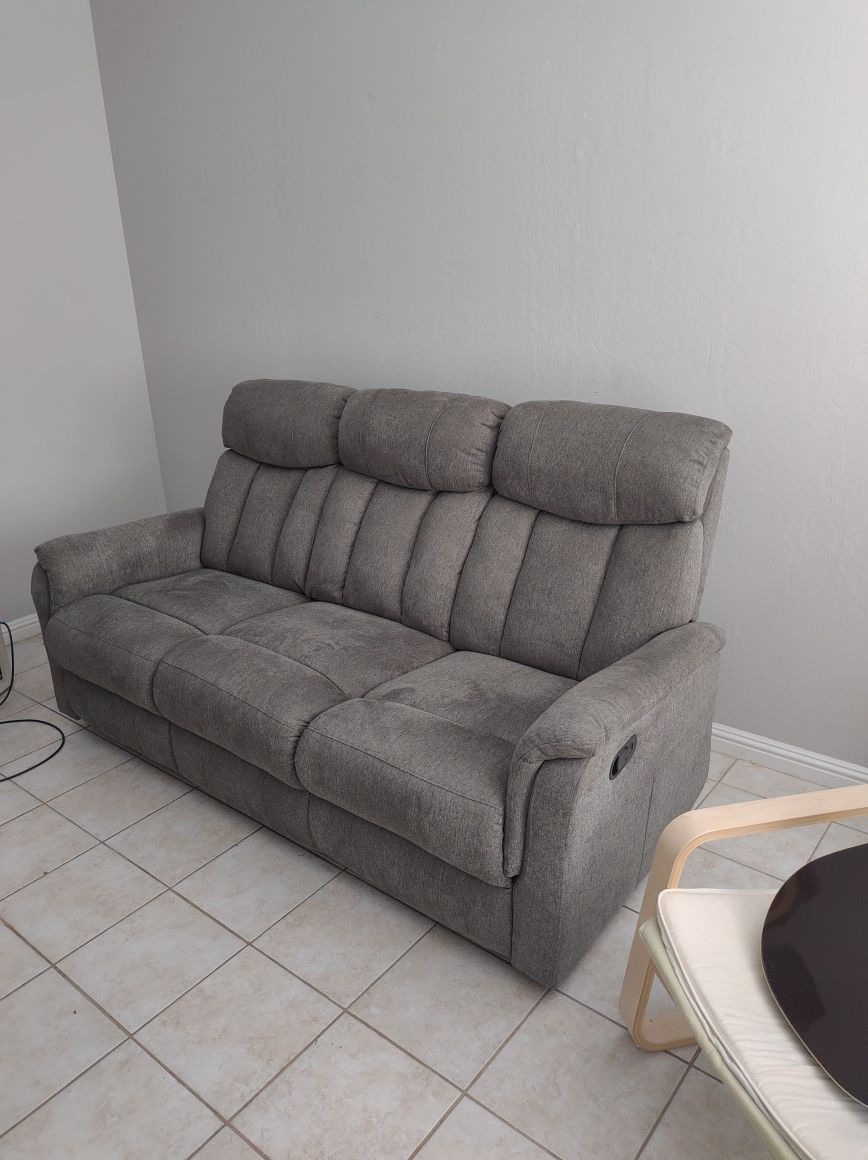 Nice comfortable reclining couch. $100