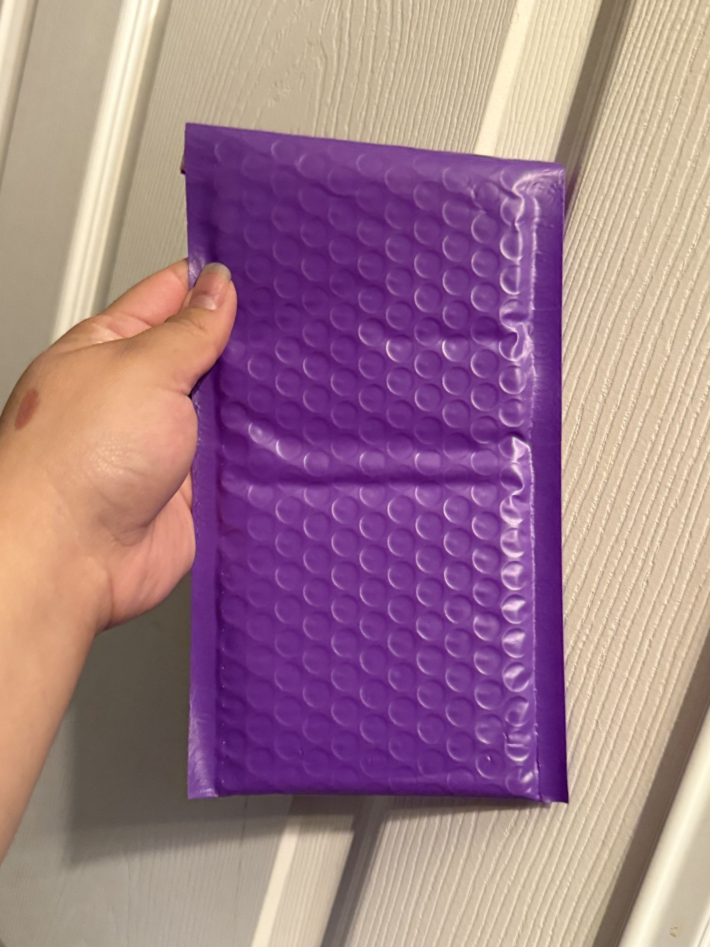 Bag Of Purple Mailer Envelopes