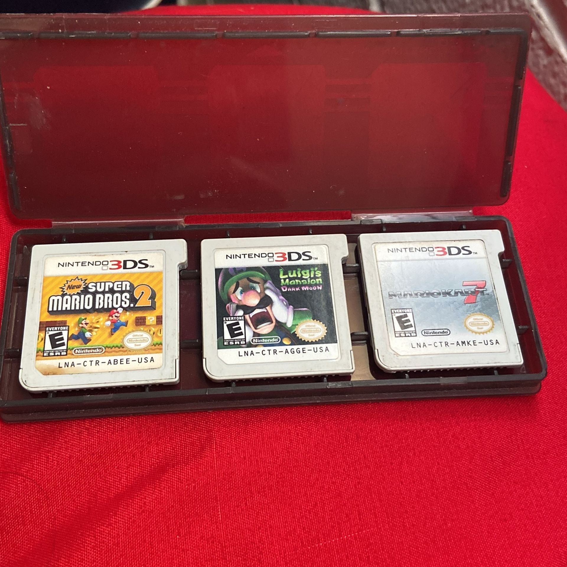 3DS games Super Mario Bros, Luigi’s Mansion, And Mariokart 7