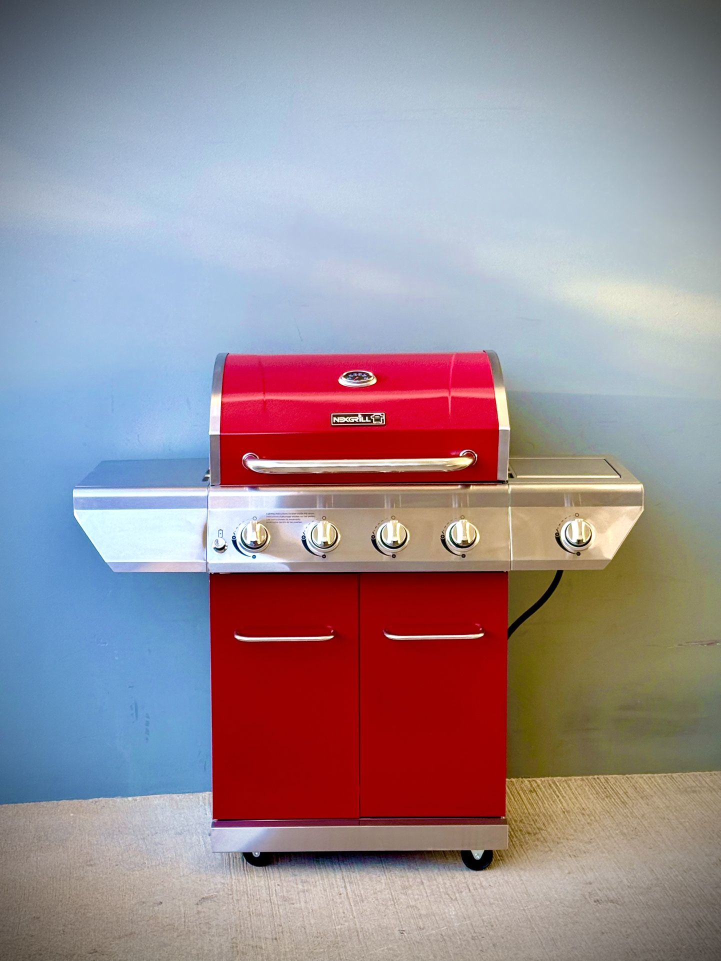 Brand new Nexgrill 4-Burner Propane Gas Grill in Red with Side Burner