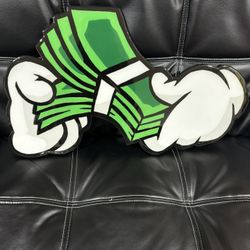 1ft by 2 ft hand holding money resin wall art