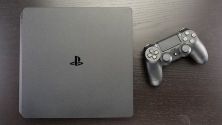 PS4 Slim w/ 2 Controllers & 2 Games