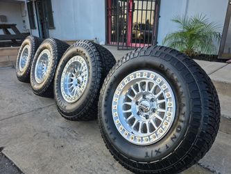 17" KMC w/ 33" Firestone AT tires