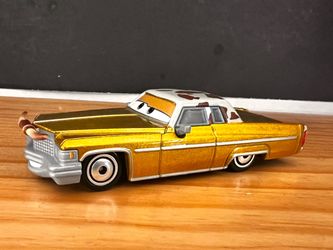DISNEY PIXAR CARS TEX DINOCO - GOOD LOW RIDER  STYLE CAR WITH BULL HORNS ON FRONT GRILL
