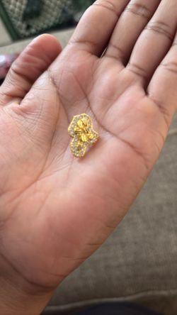 1 male earring and one woman’s bracelet