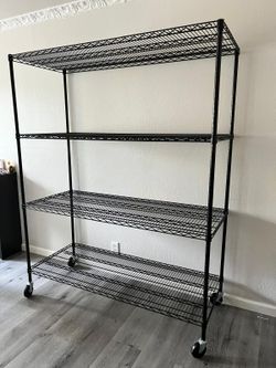 HEAVY DUTY 4 Tier shelf with Wheels **SHELVES ARE ADJUSTABLE** GREAT CONDITION!!