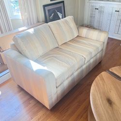 Two matching sofas, see photos for color