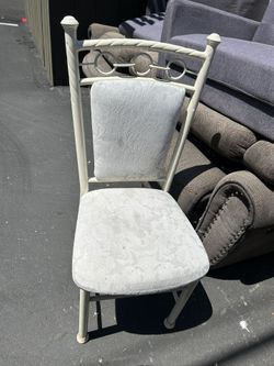 White-painted metal frame chair with white fabric upholstered back and seat.