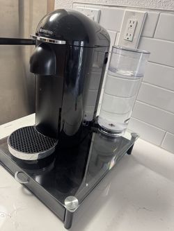 Nesspresso machine set up with glass and pod holder