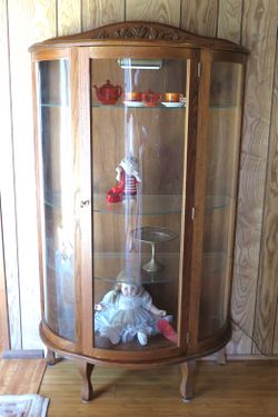 Solid oak curved glass display cabinet - $75