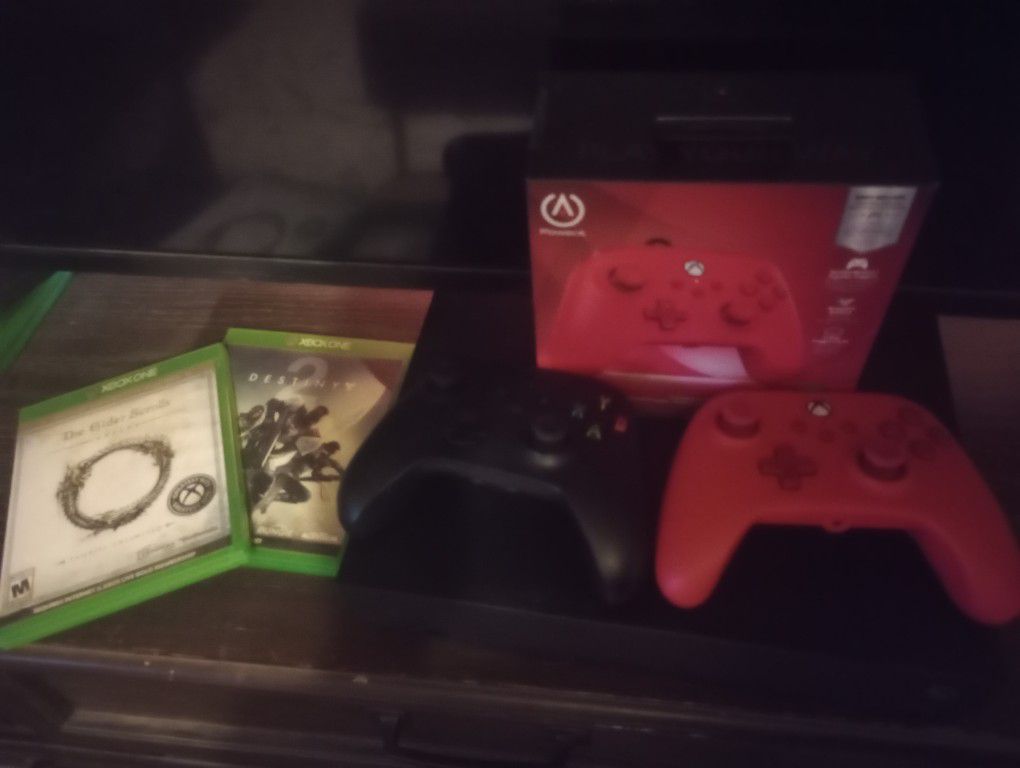 Xbox One X, 2 Controllers, And 2 Games