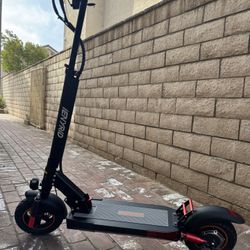 Double shock-absorbing electric scooter