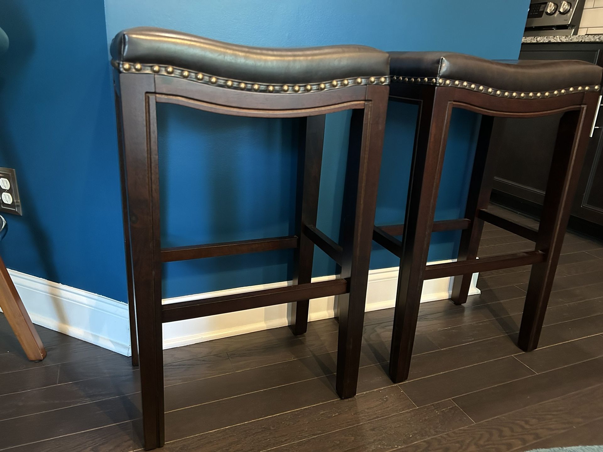 Two Transitional Saddle Barstools