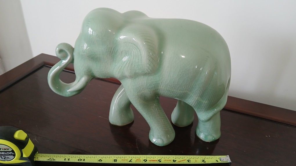 Celadon ceramic elephant figurine.