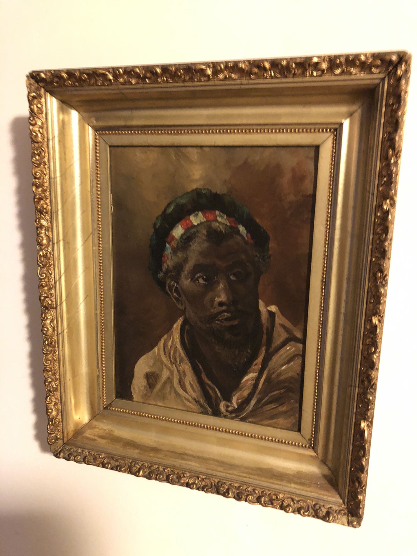 Antique Oil Painting of a Dark Man in a Cap