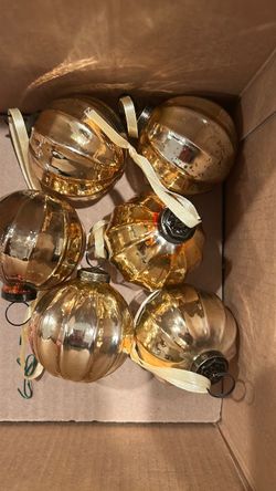 Six gold glass ornaments