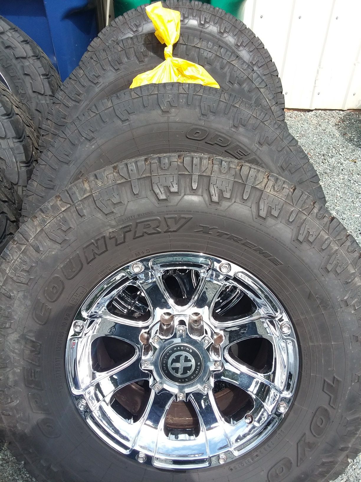17" American Racing ATX Series AX188 Ledge 8 lug chrome rims with lugs. With Toyo All Terrane 285/75/R17 used tires.