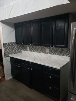 painting and installation of kitchen cabinets 