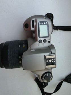 Canon EOS Rebel XS N 35mm film camera with Canon EF 35-80mm f/4-5.6 III lens.