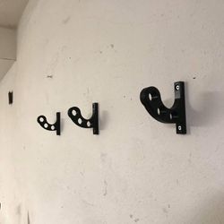 Wall mounted motorcycle stand, helmet, and accessories hanger
