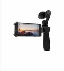 Dji Osmo fully stabilized 4k 12mp camera with extra accessories 2 battery and 2 microphone come with pro bag