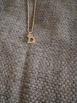 Yellow gold rope chain with a D pendant