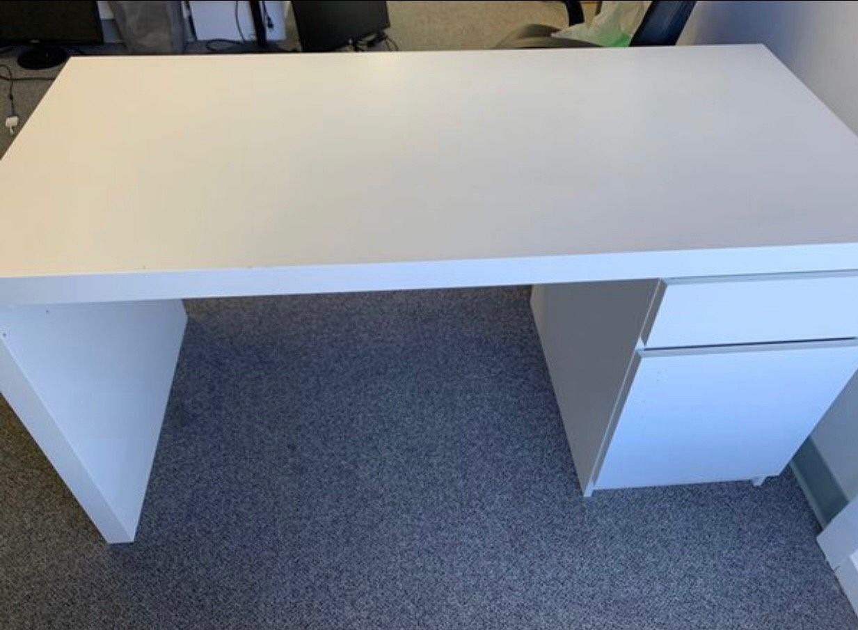 Sturdy white/ offwhite desk 55 ish “ by 24”. Might be 60. Have to measure